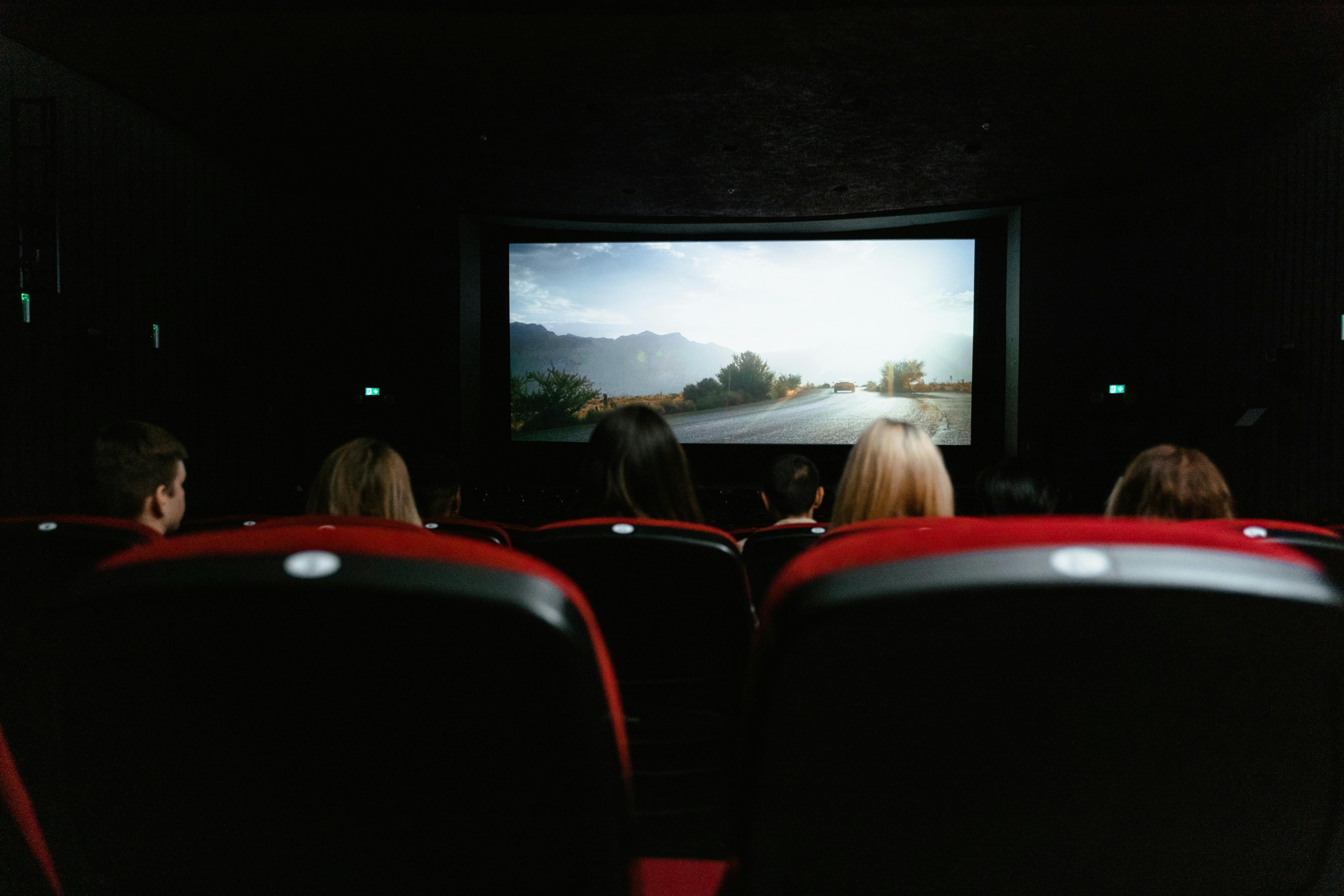 behind audience watching a cinema screening, video analysis platform